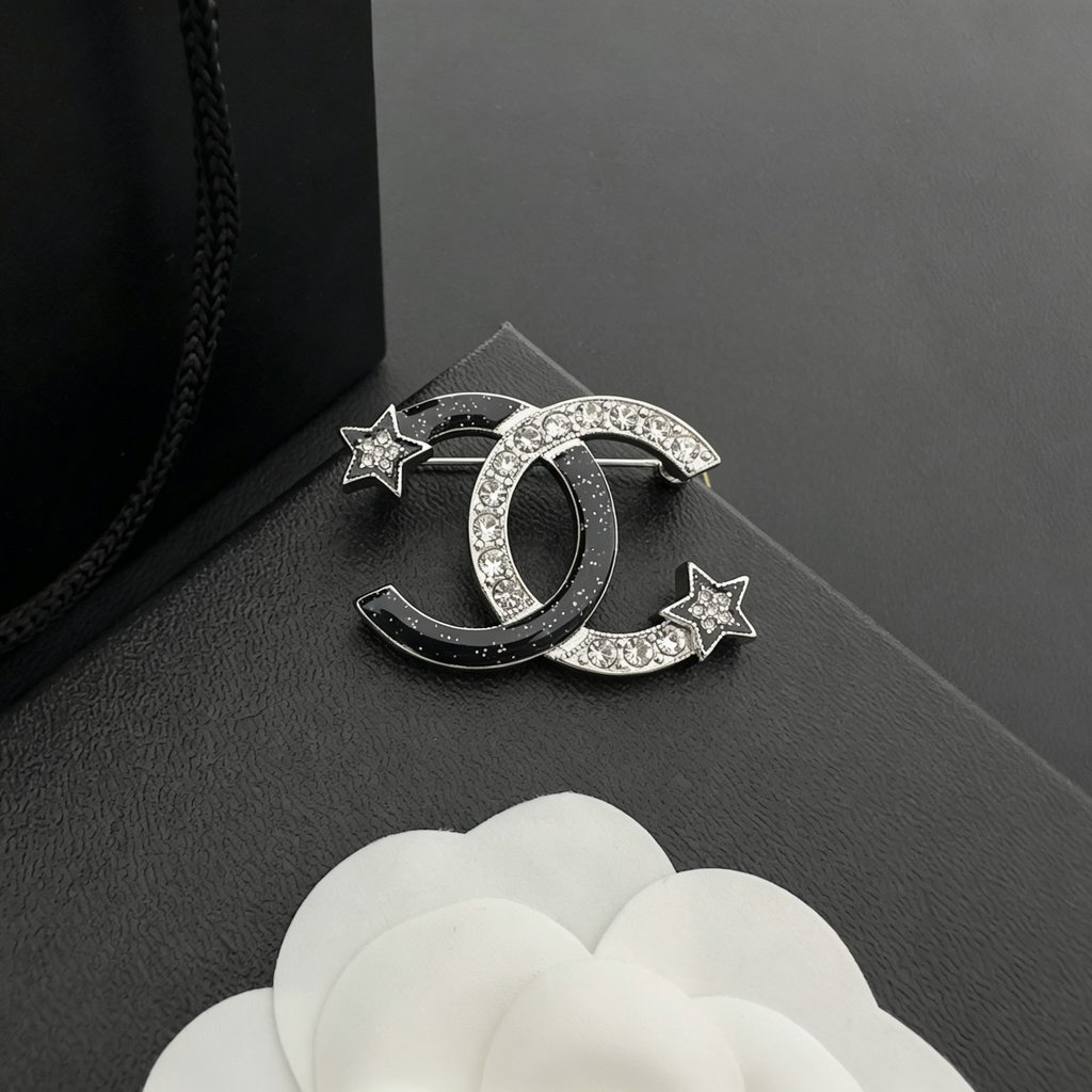 Interlocking C Star Brooch – Black Enamel & Crystal Pavé