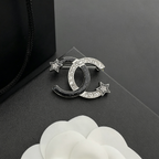 Interlocking C Star Brooch – Black Enamel & Crystal Pavé