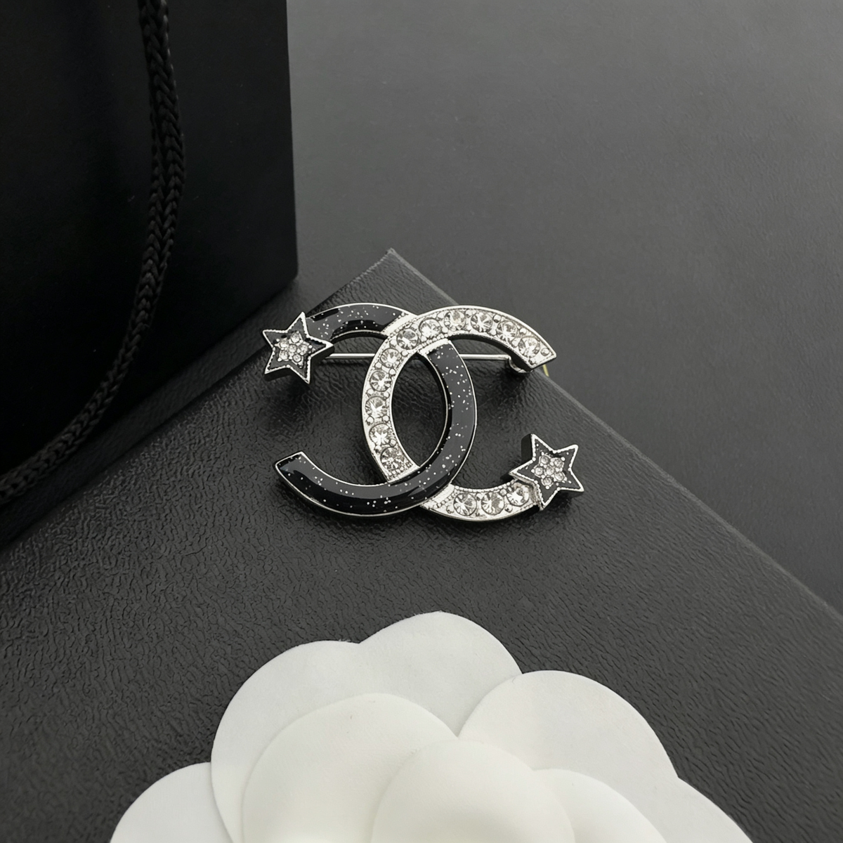 Interlocking C Star Brooch – Black Enamel & Crystal Pavé