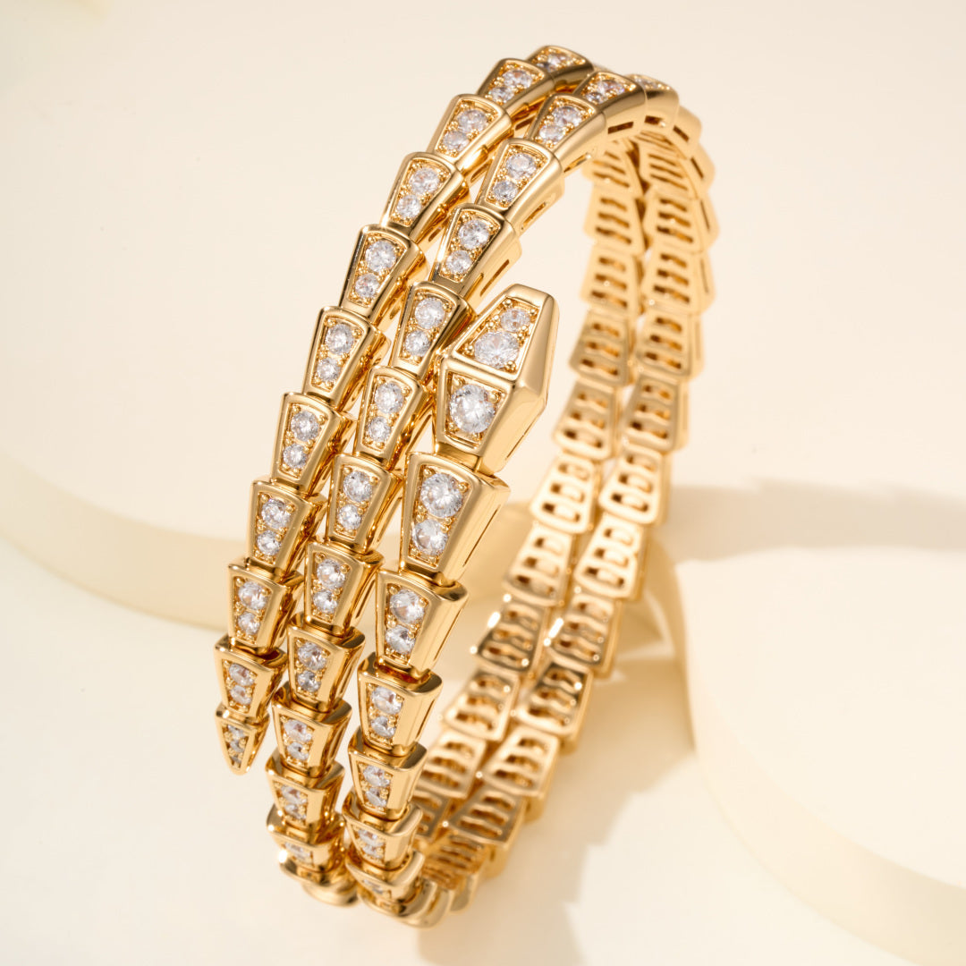 Double-Loop Serpent Bangle with Gemstones – Coiled Snake Design