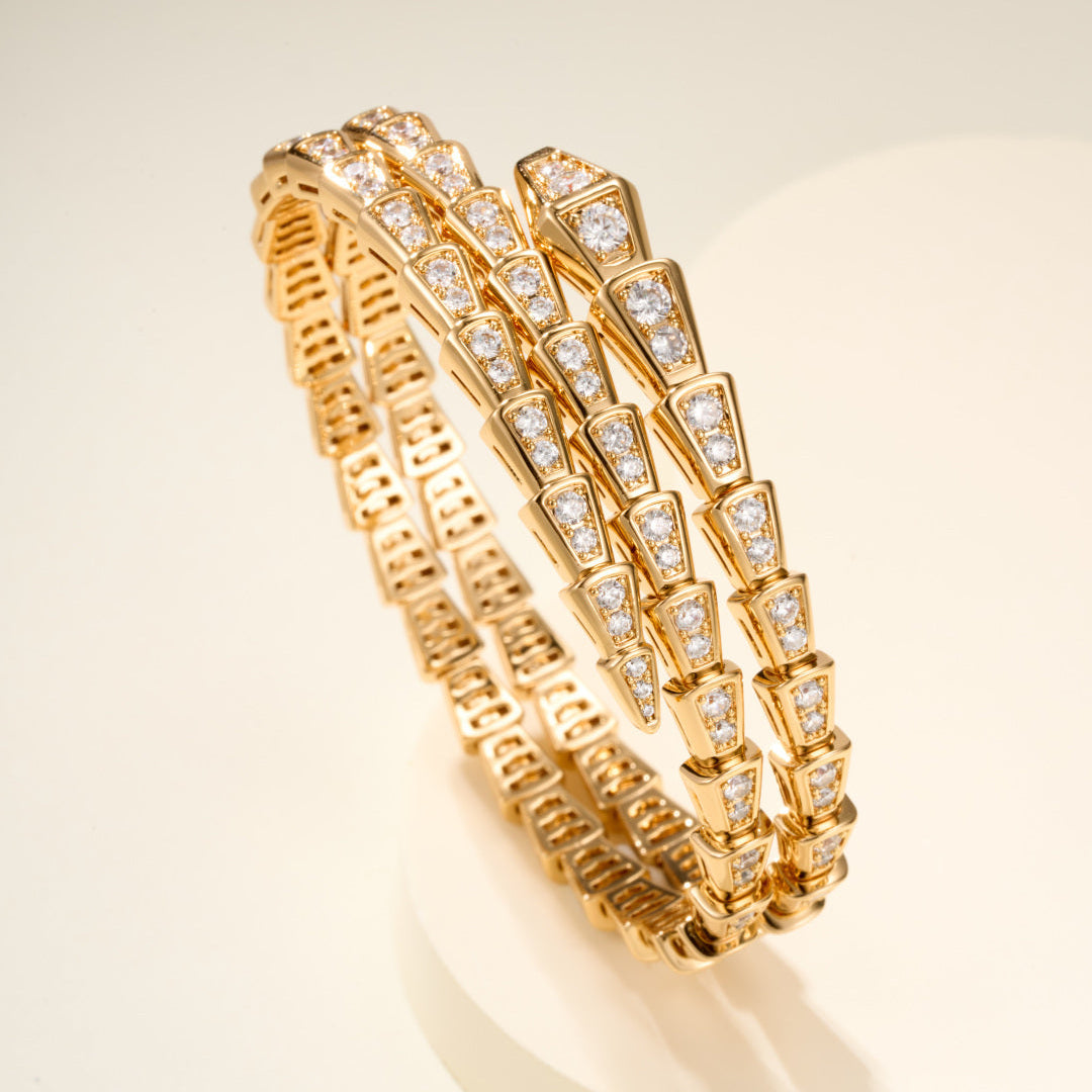 Double-Loop Serpent Bangle with Gemstones – Coiled Snake Design