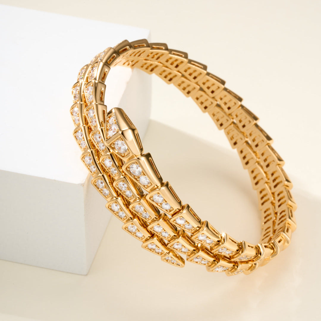 Double-Loop Serpent Bangle with Gemstones – Coiled Snake Design