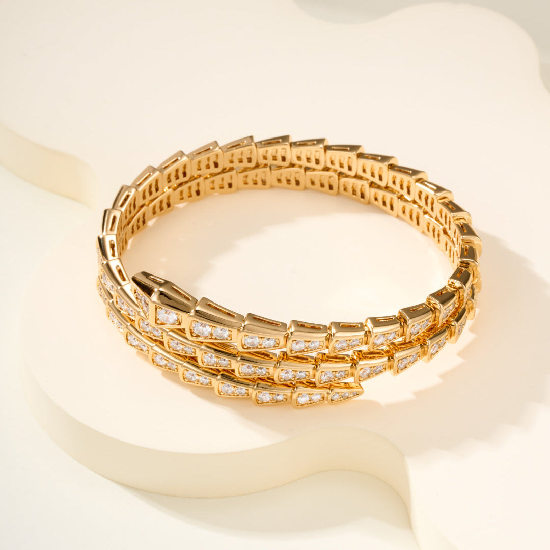 Double-Loop Serpent Bangle with Gemstones – Coiled Snake Design