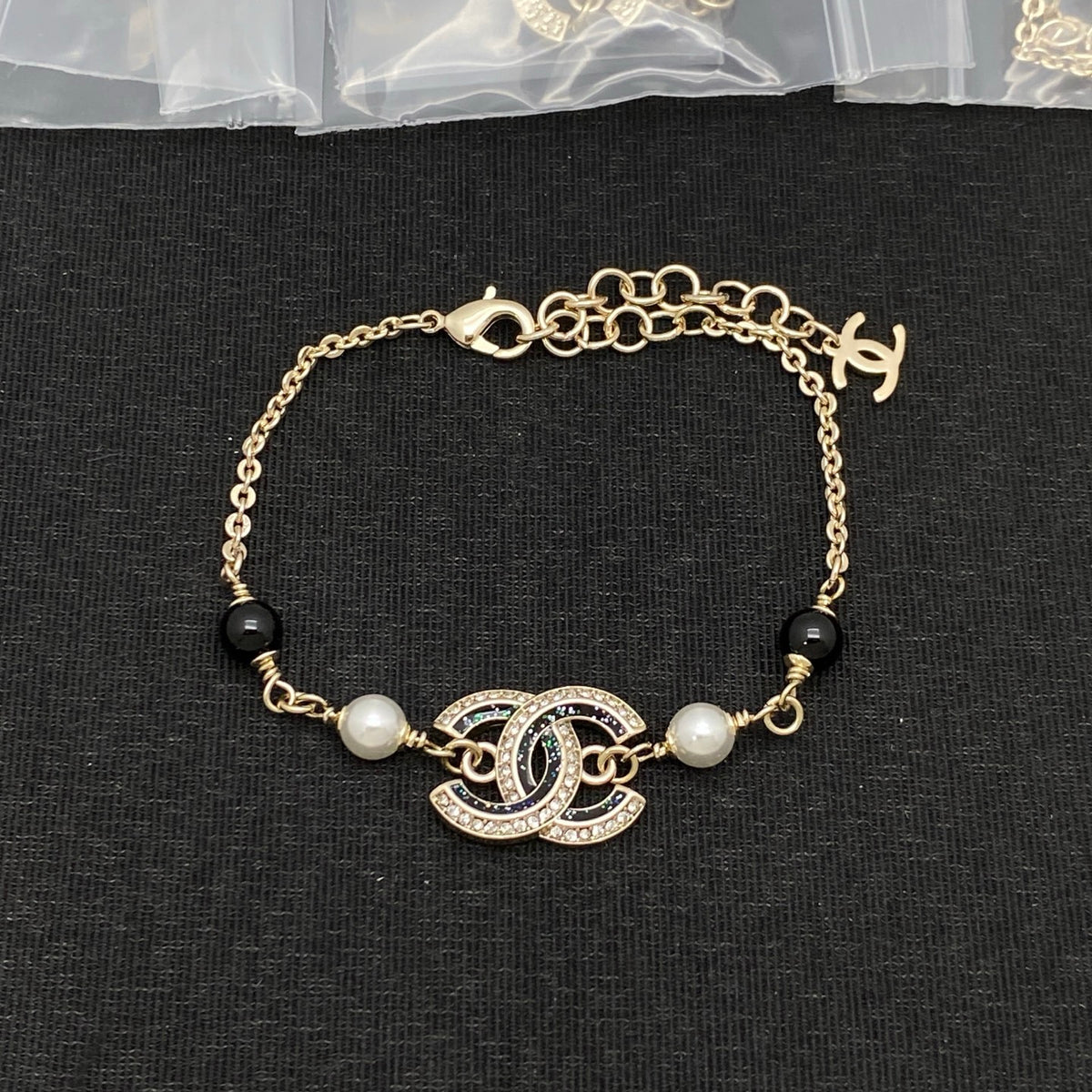Interlocking C Station Bracelet – Black Enamel and Lustrous Beads