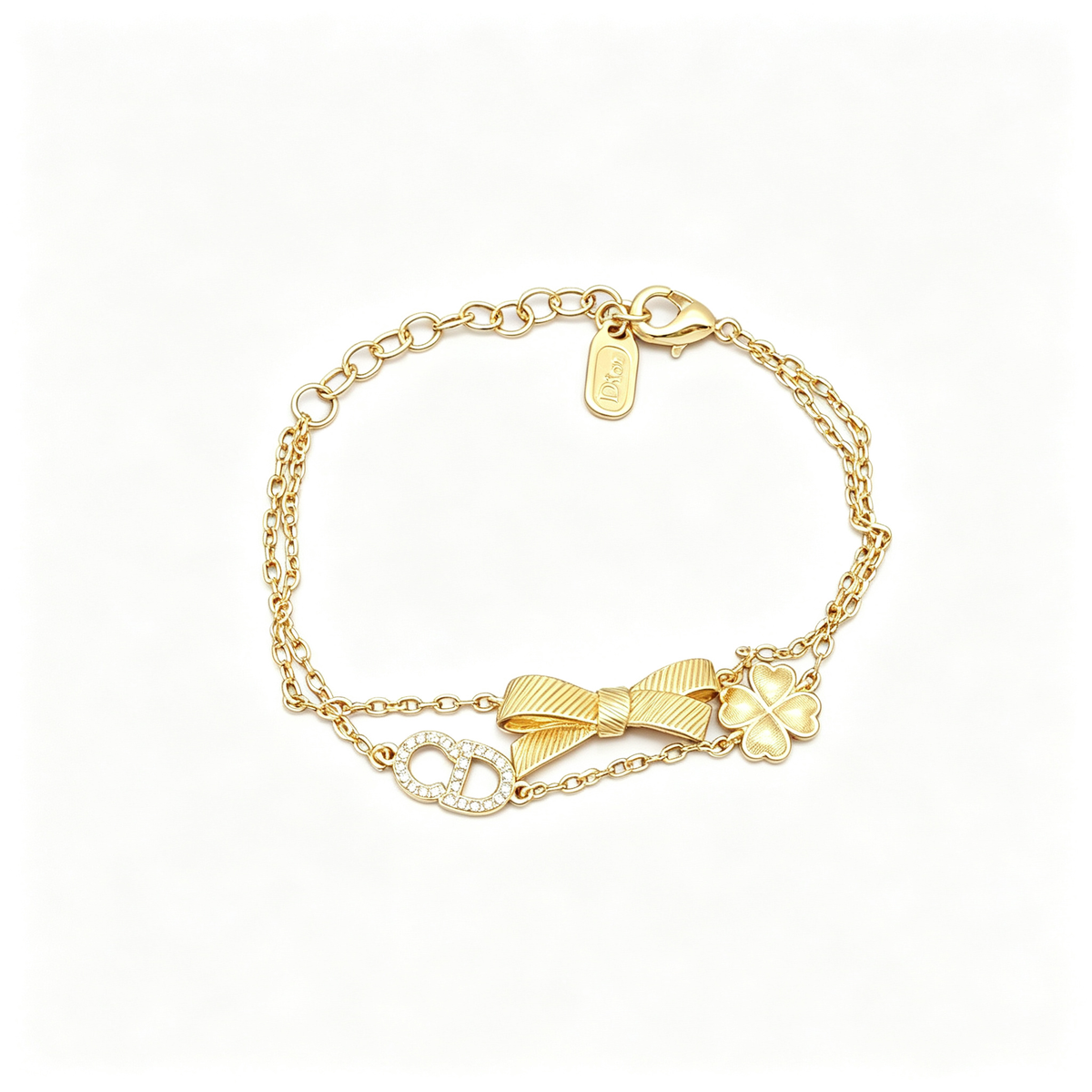 Double Strand Charm Bracelet – Pavé Monogram, Ribbed Bow and Clover