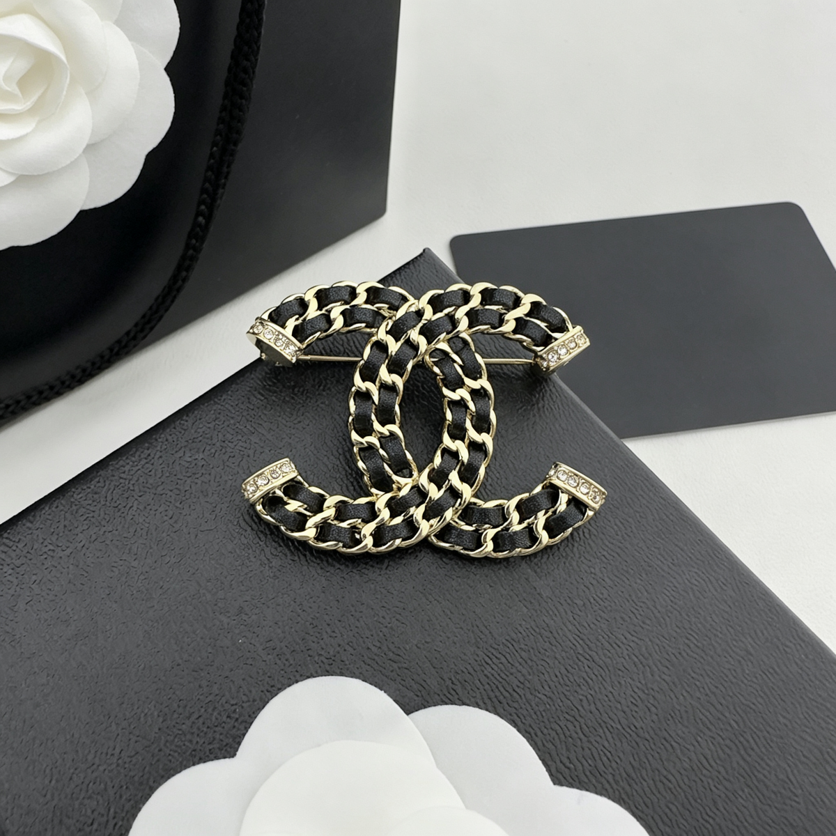 Leather-Woven Chain Interlocking C Brooch – Pavé End Caps