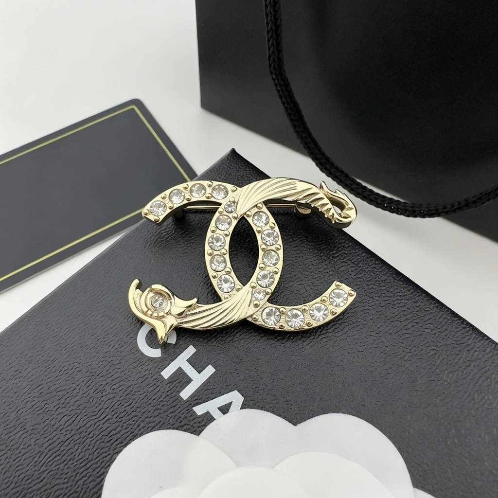 Crystal Interlocking C Brooch – Sculpted Wave Overlay