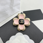 Pink Enamel Four-Petal Flower Brooch – Textured Metal with Interlocking C