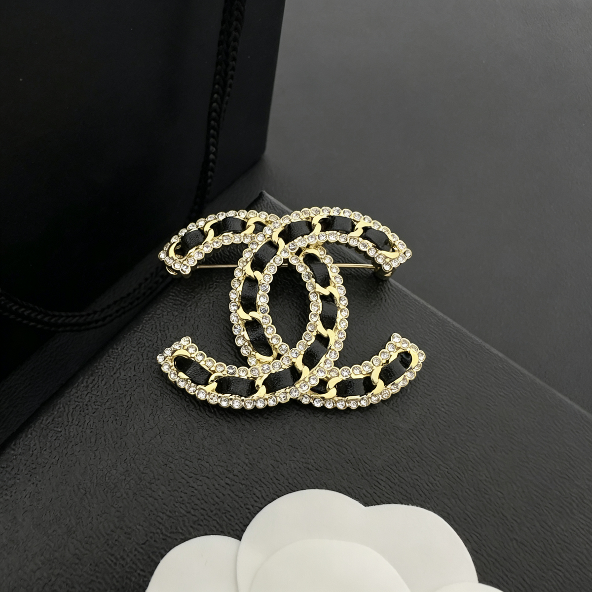 Interlocking C Woven Leather Brooch – Crystal Edges
