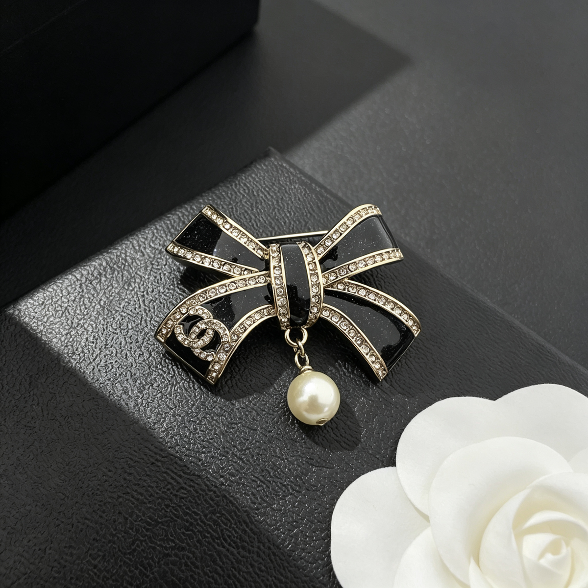 Black Glitter Enamel Bow Brooch – Crystal Edges & Bead Drop