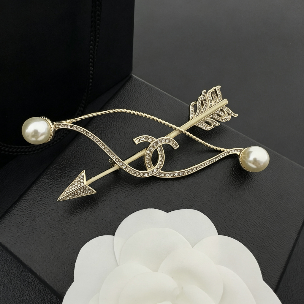 Crystal Arrow Brooch – Interlocking C & Lustrous Bead Ends
